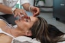 person holding woman nose