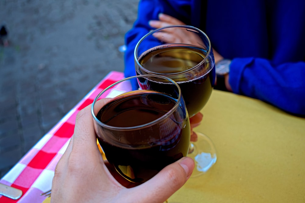 person holding wine glass