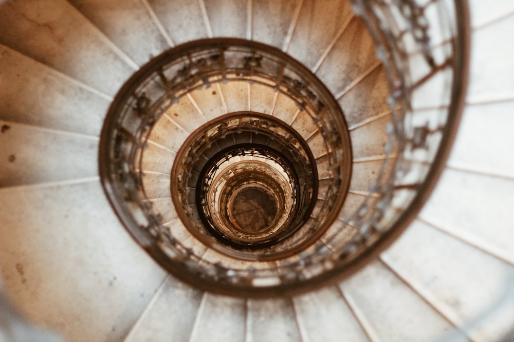 top-view of gray concrete spiral stairway