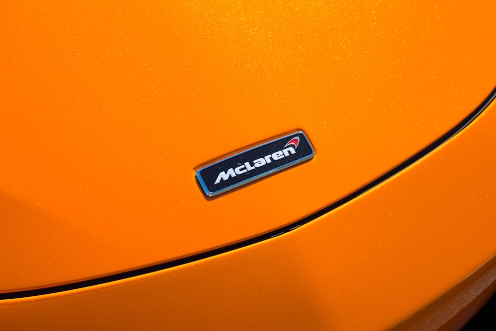 close-up photo of orange McLaren tool