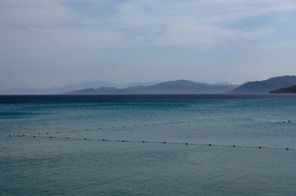 ocean water under cloudy sky