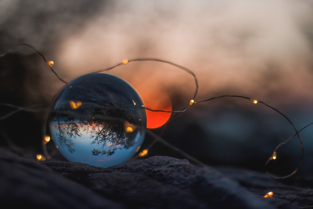 round clear ball on black cloth