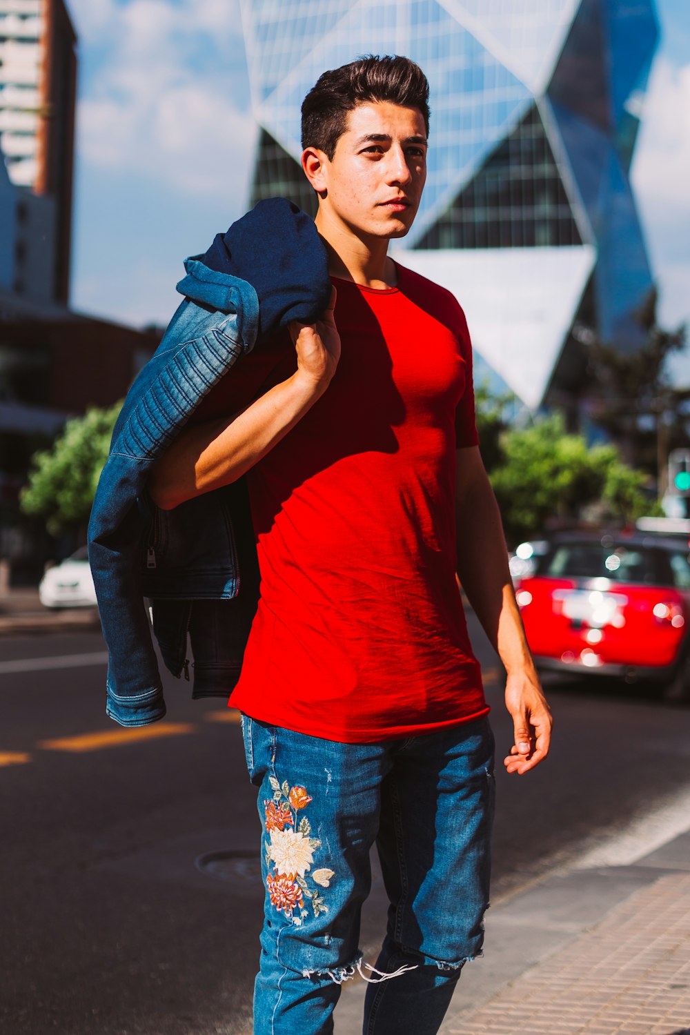 man carrying blue jacket