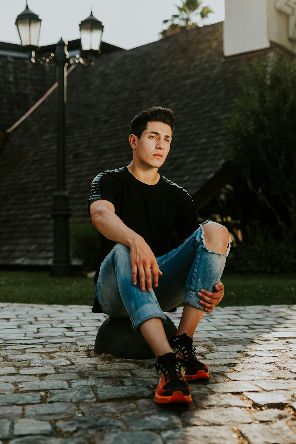 man sitting on stone