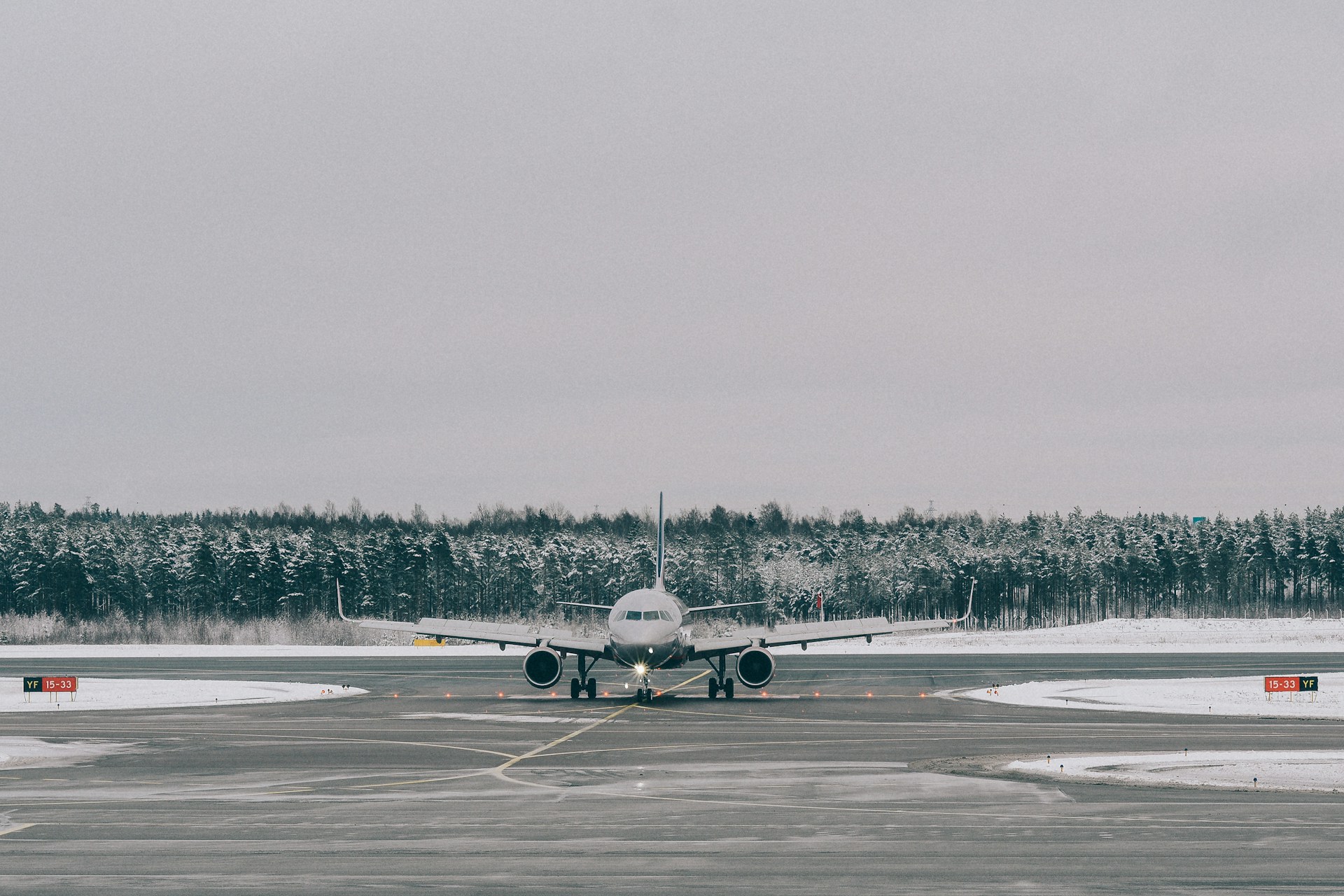 gray airplane on field