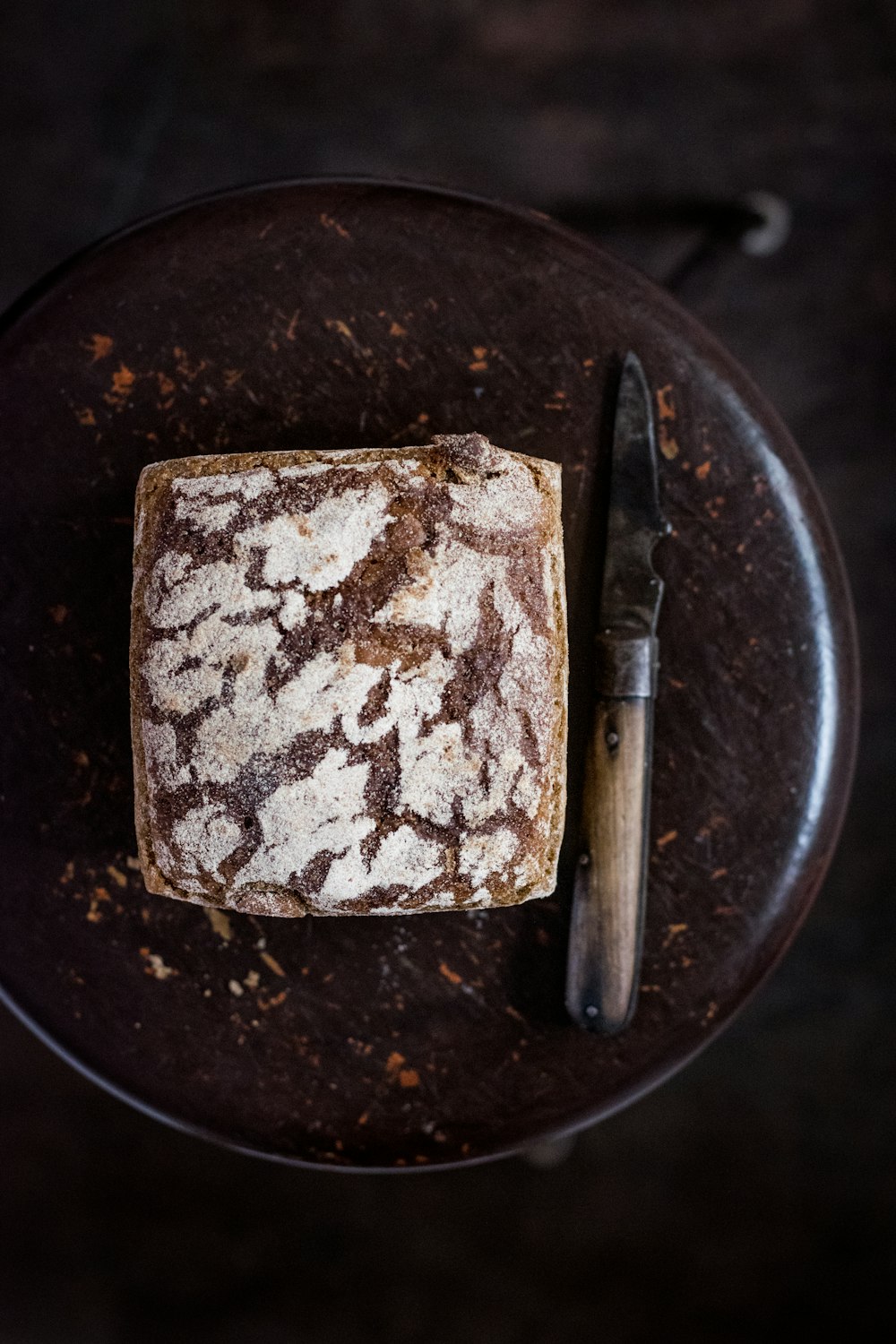 bread beside knife on chair