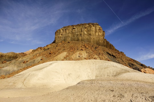 brown mountain during daytime in Grand Staircase-Escalante National Monument United States