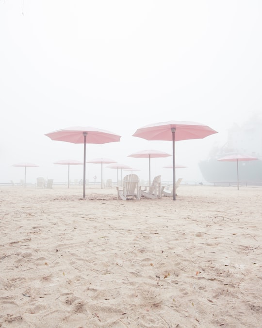 pink canopy umbrellas in beach in Sugar Beach Canada