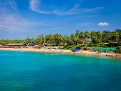 blue body of water under sunny sky