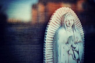 A peaceful figure meditating with soft light surrounding them.