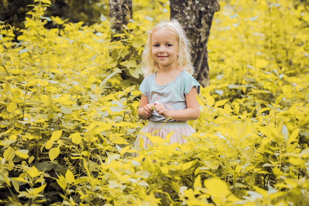 girl in yellow plant field