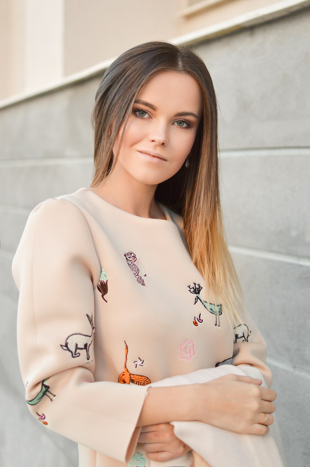 woman in beige and green long-sleeved shirt