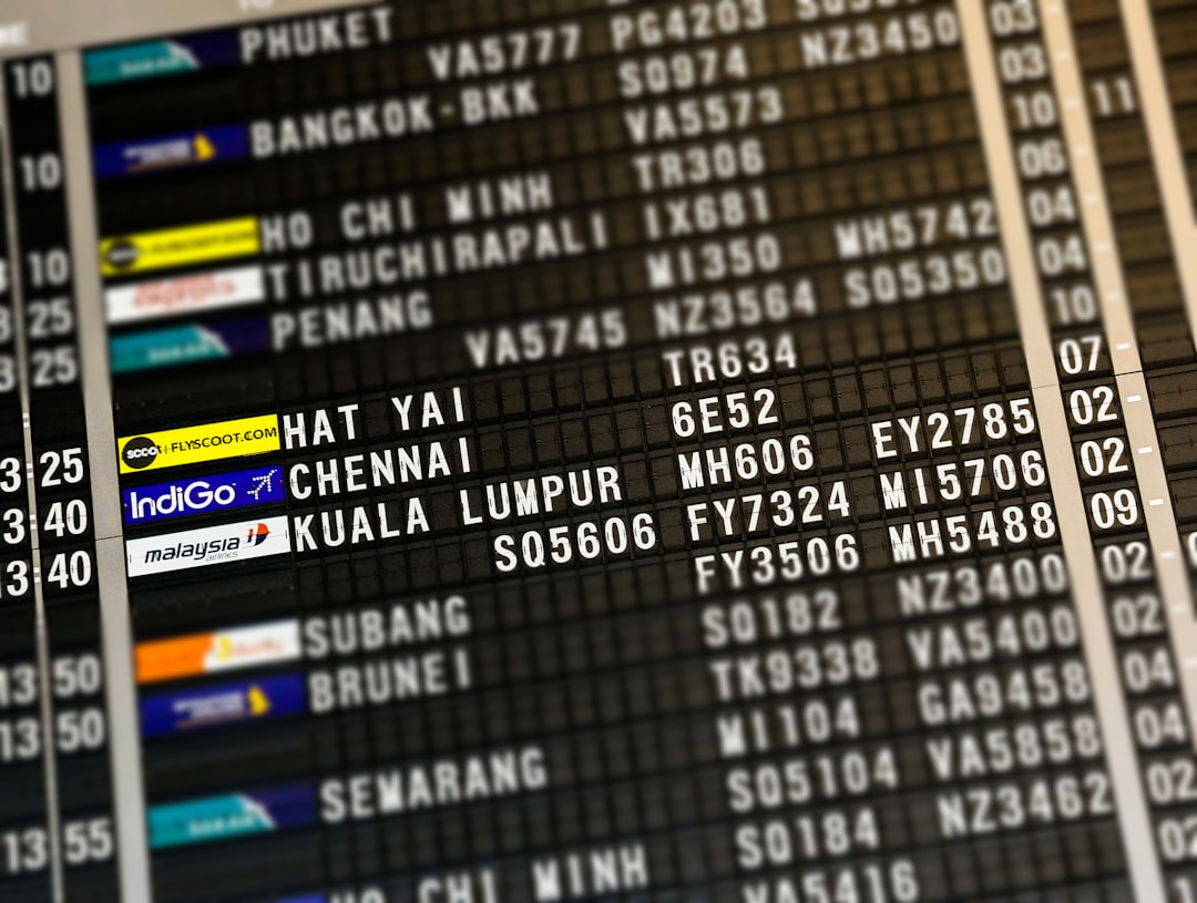 flight board highlighting Hat Yai, Chennai, and Kuala Lumpur, Wait…
