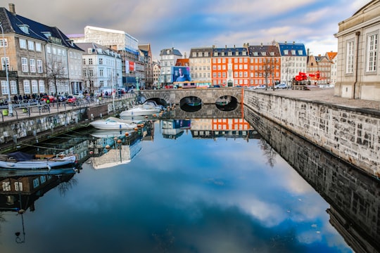 white concrete buildings near body of water in National Museum of Denmark Denmark