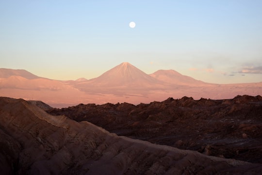 aerial view of mountain with a scene of moon in Valle de la Luna Chile