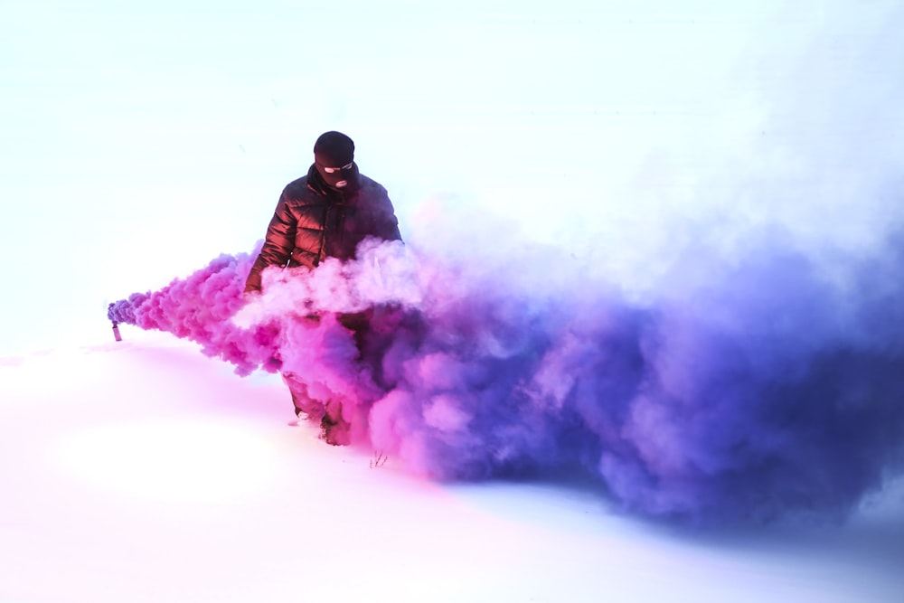 person walking on purple smoke