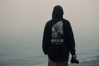 person facing body of water