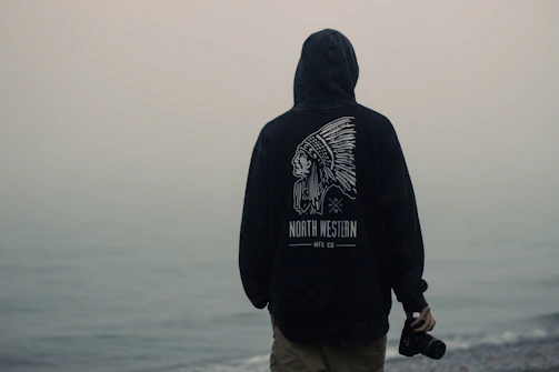 person facing body of water