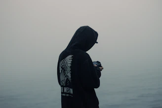 photo of man person wearing black hoodie
