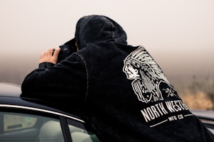 man holding DSLR camera