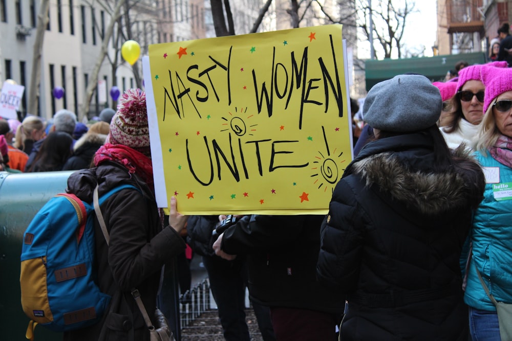 people holding poster