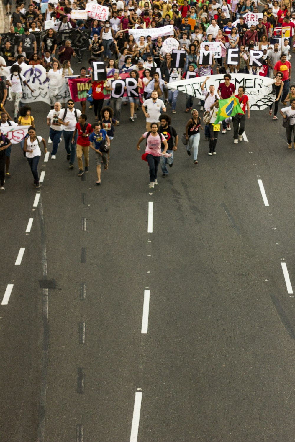 people rallying on road during daytime