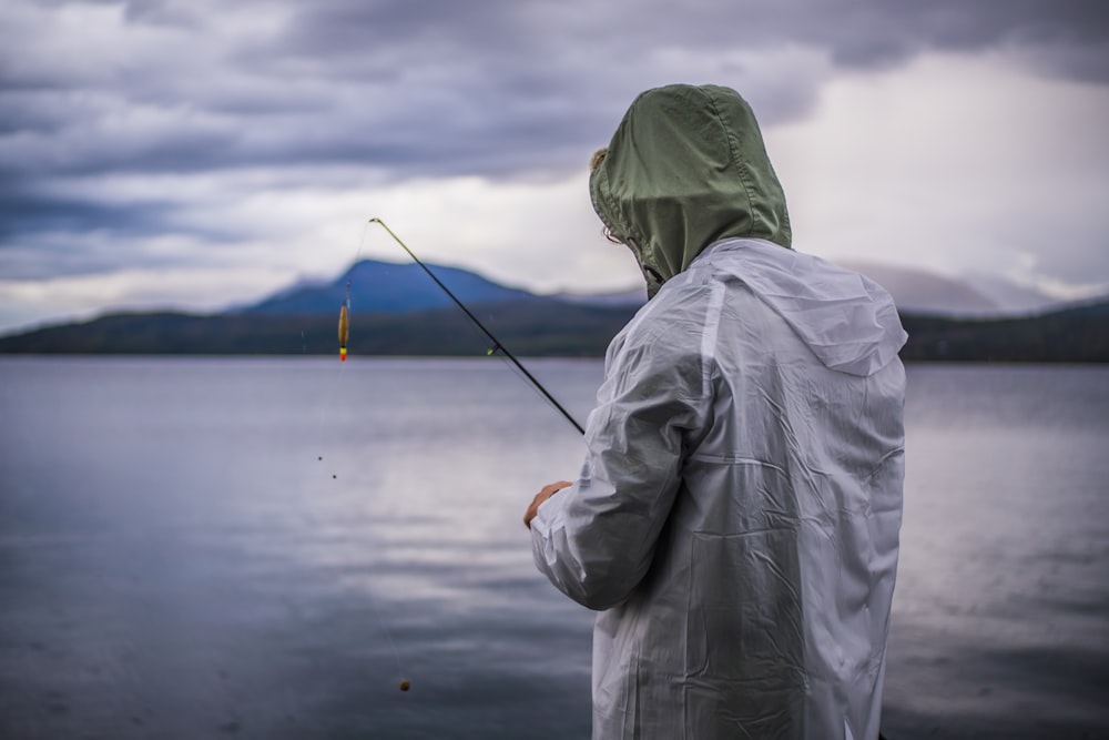 person fishing on body of water