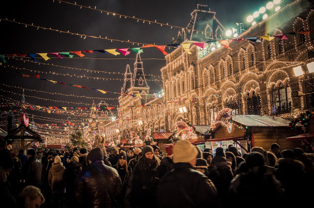 event photography of people gather outside light strings covered building, HNY@Moscow city