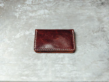 Close-up of a sleek leather wallet with fine stitching.