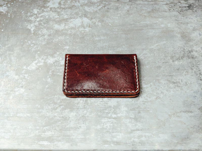 A stylish photo gallery showcasing various wallet designs in natural light.