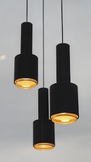 three black pendant lamps