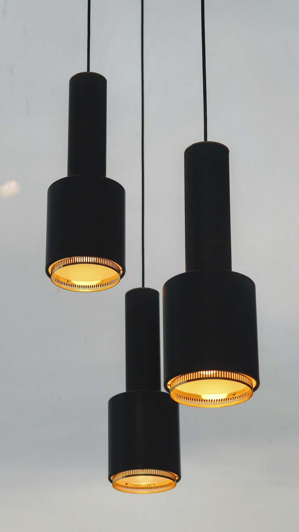 three black pendant lamps