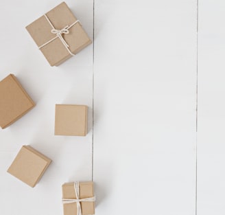 brown gift box on white surface