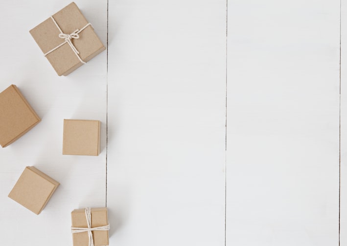 brown gift box on white surface