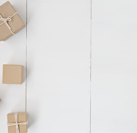 brown gift box on white surface