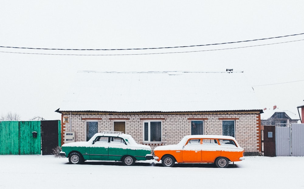 two green and white cars on snowfield