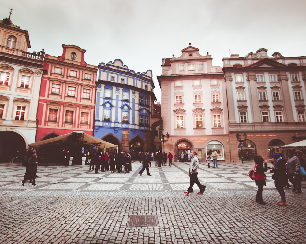 people walking in front of buildings