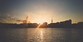 A scenic view of a city skyline at sunset, symbolizing news coverage.