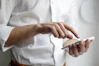 person holding white Android smartphone in white shirt
