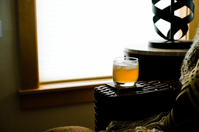 A cozy, inviting shot of a customer enjoying zenith9’s product in a sunlit local setting.