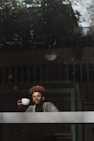 man holding coffee cup