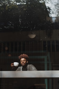 man holding coffee cup