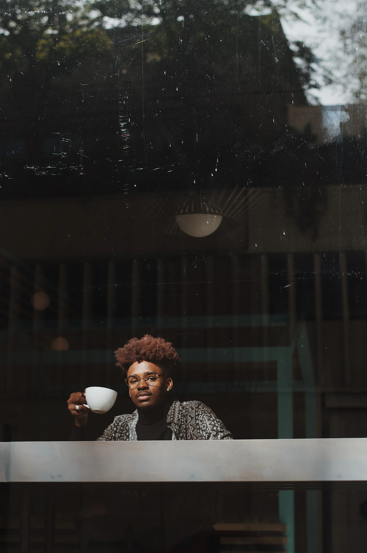 Friends laughing together over coffee