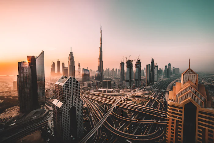 Dubai's towers and looping motorway interchanges at sunrise