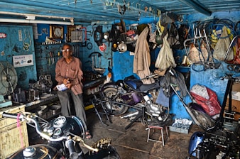 man sitting inside garage