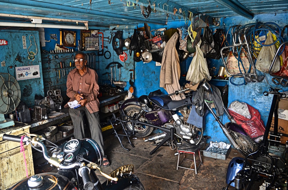 man sitting inside garage