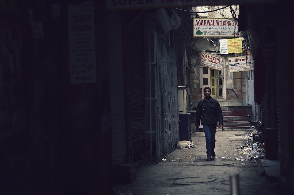 man walking in the street during daytime