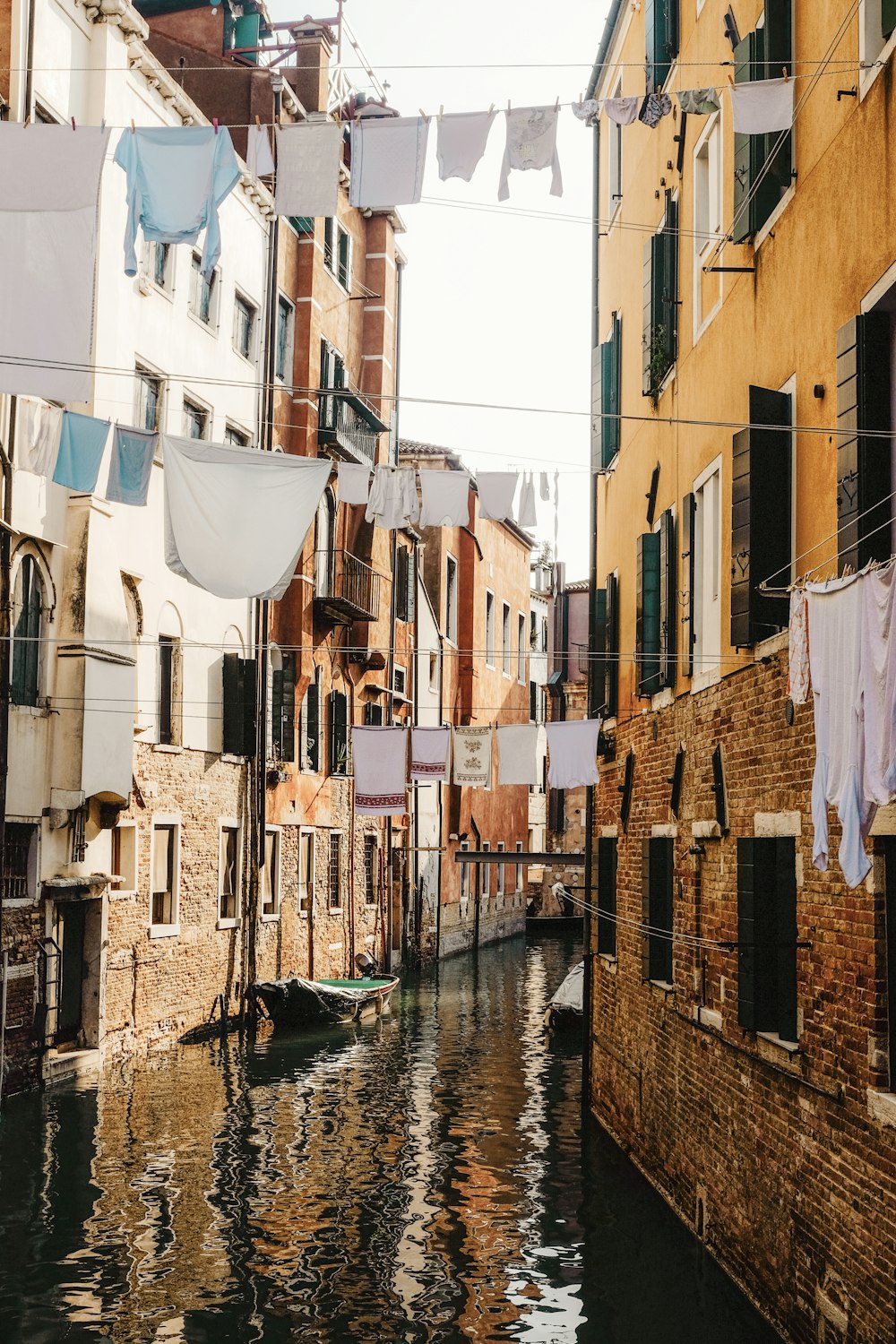 clothing hanging on cable between concrete houses