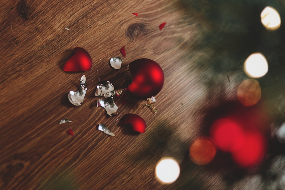 broken red bauble on brown floor