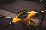 photo of yellow motor scooter